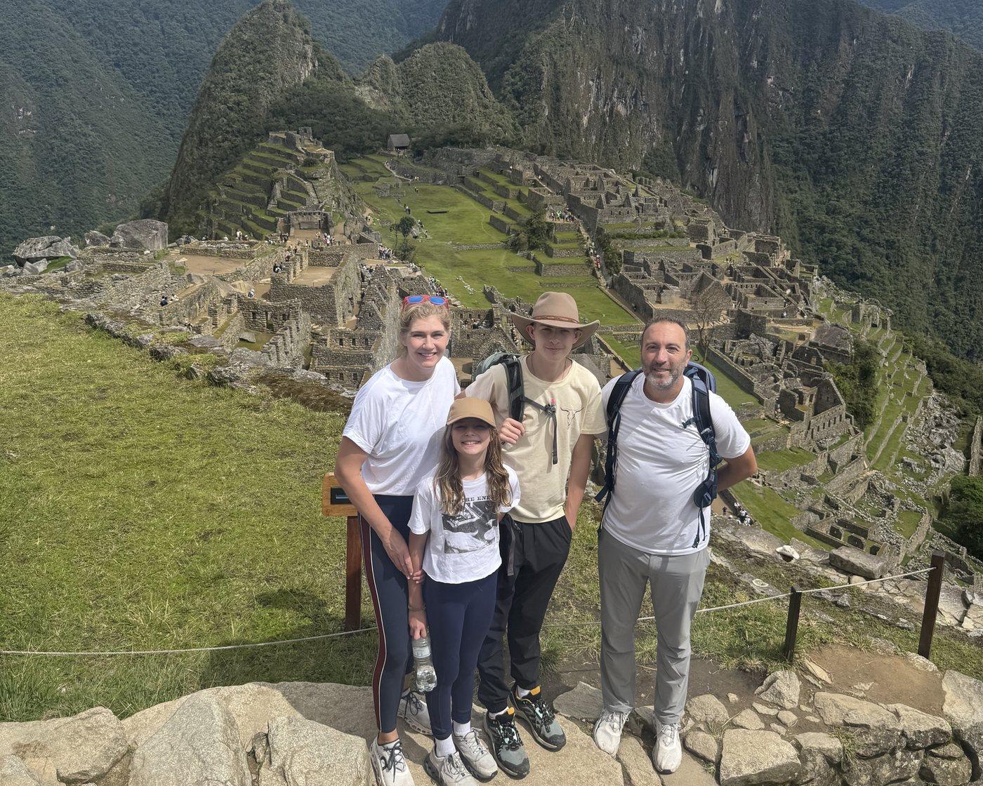 A family standing together at Machu Picchu