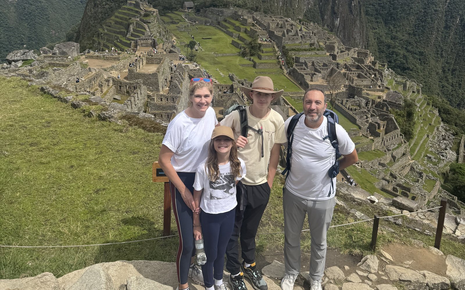A family standing together at Machu Picchu